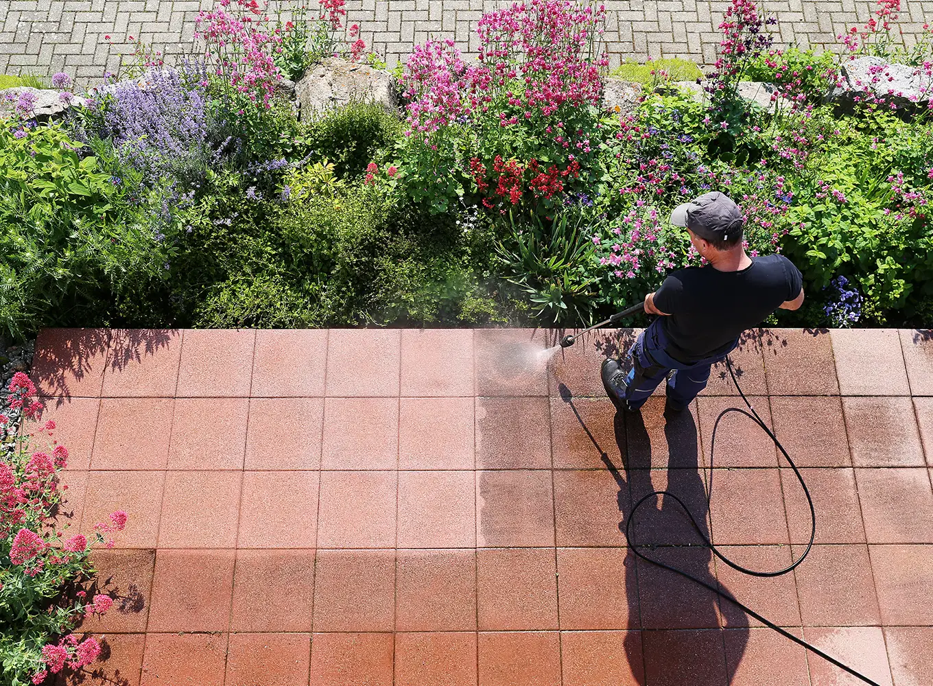 power washing company cleaning patio bricks with power washer in collinsville il