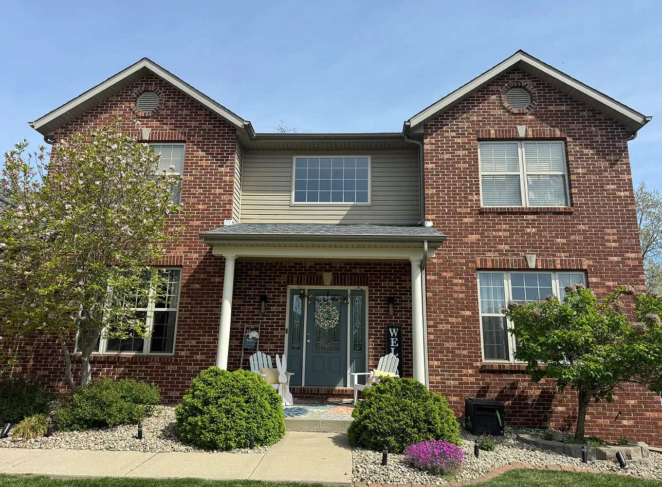 The front of a home cleaned after a power washing service in Grafton IL